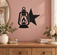 Black vinyl decal of lantern with flame and a star beside it