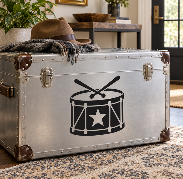 Vinyl drum and star decal with black drum icon on silver-toned surface