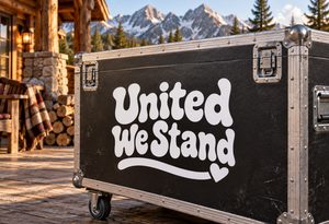 Vinyl decal with bold white “United We Stand” lettering and a small heart underline