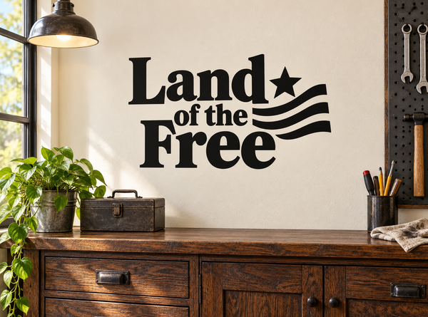 Vinyl wall decal with 'Land of the Free' text, star and striped flag graphic, black