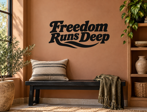 Freedom Runs Deep vinyl decal in black, wall text with curved underline swoosh