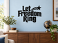 Vinyl decal reading "Let Freedom Ring" in bold black lettering with arrow and star
