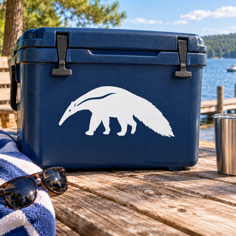 Giant anteater vinyl decal on blue surface, white walking animal with sweeping tail.
