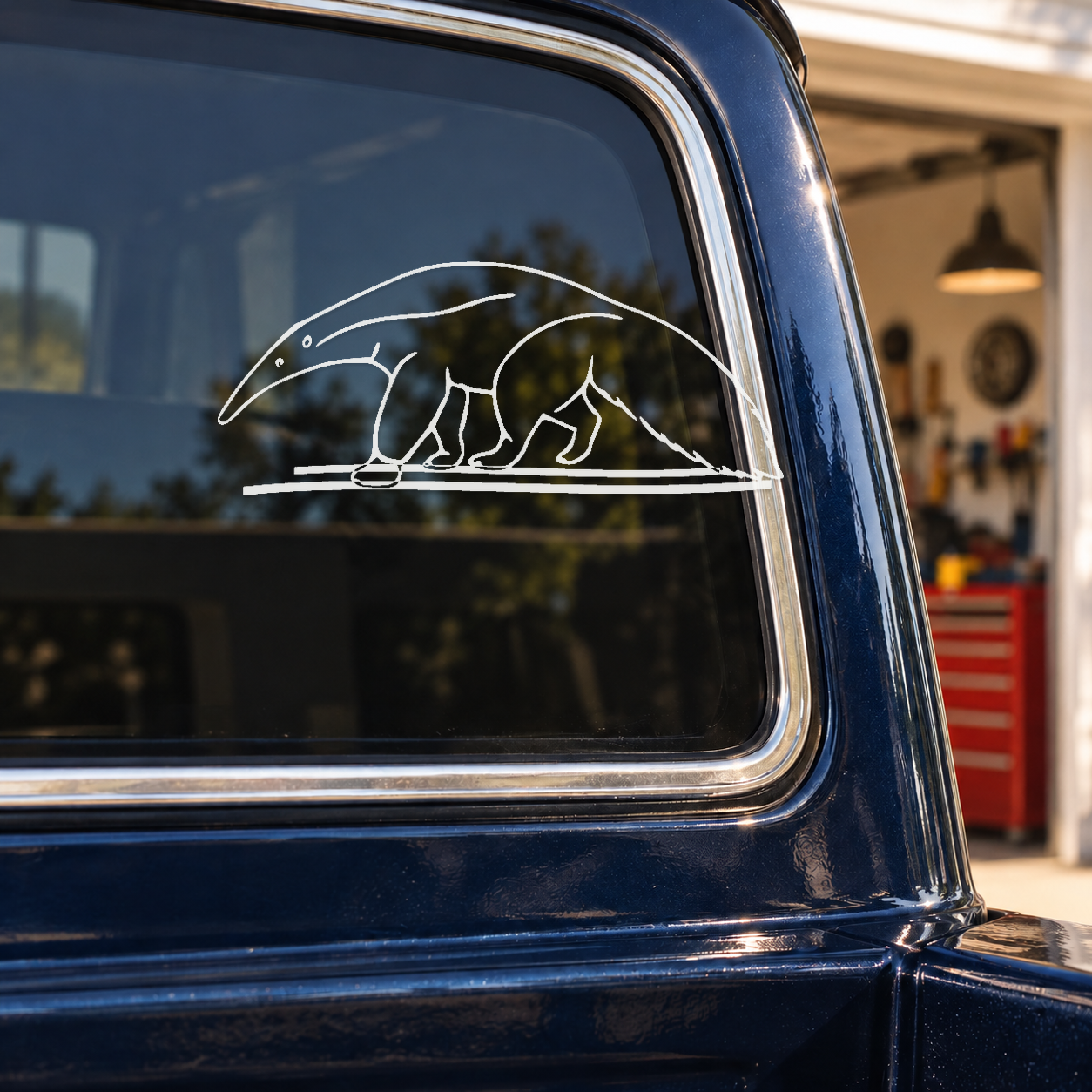 Outline graphic decal of a walking giant anteater with twin wind swooshes