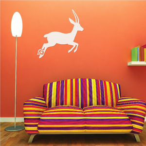 White leaping antelope vinyl wall decal with double orbit rings detail