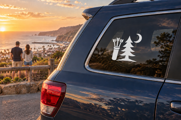 Vinyl forest moon archery decal with quiver, tree, and crescent moon on car window