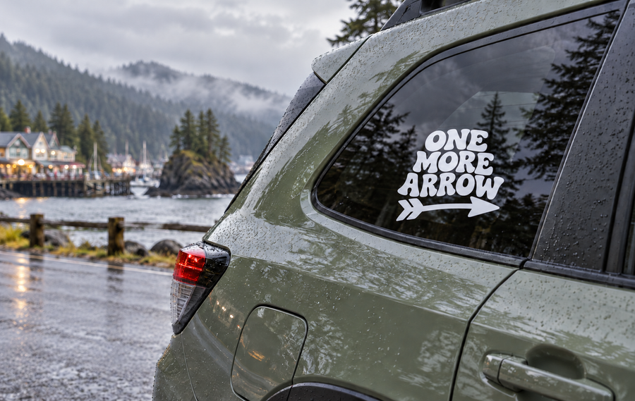 Vinyl decal with "ONE MORE ARROW" text and arrow graphic on a car window