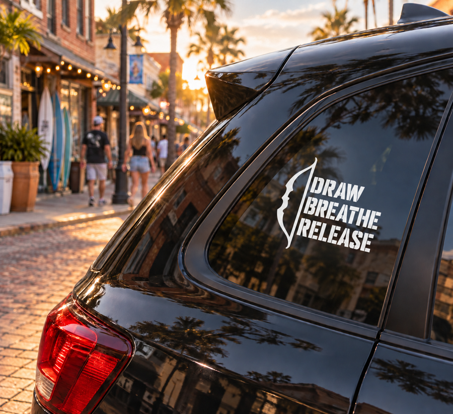 Archery vinyl decal with bow icon and text "DRAW BREATHE RELEASE" on car window