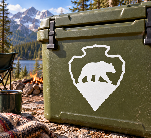 White bear silhouette arrowhead vinyl decal on a green surface