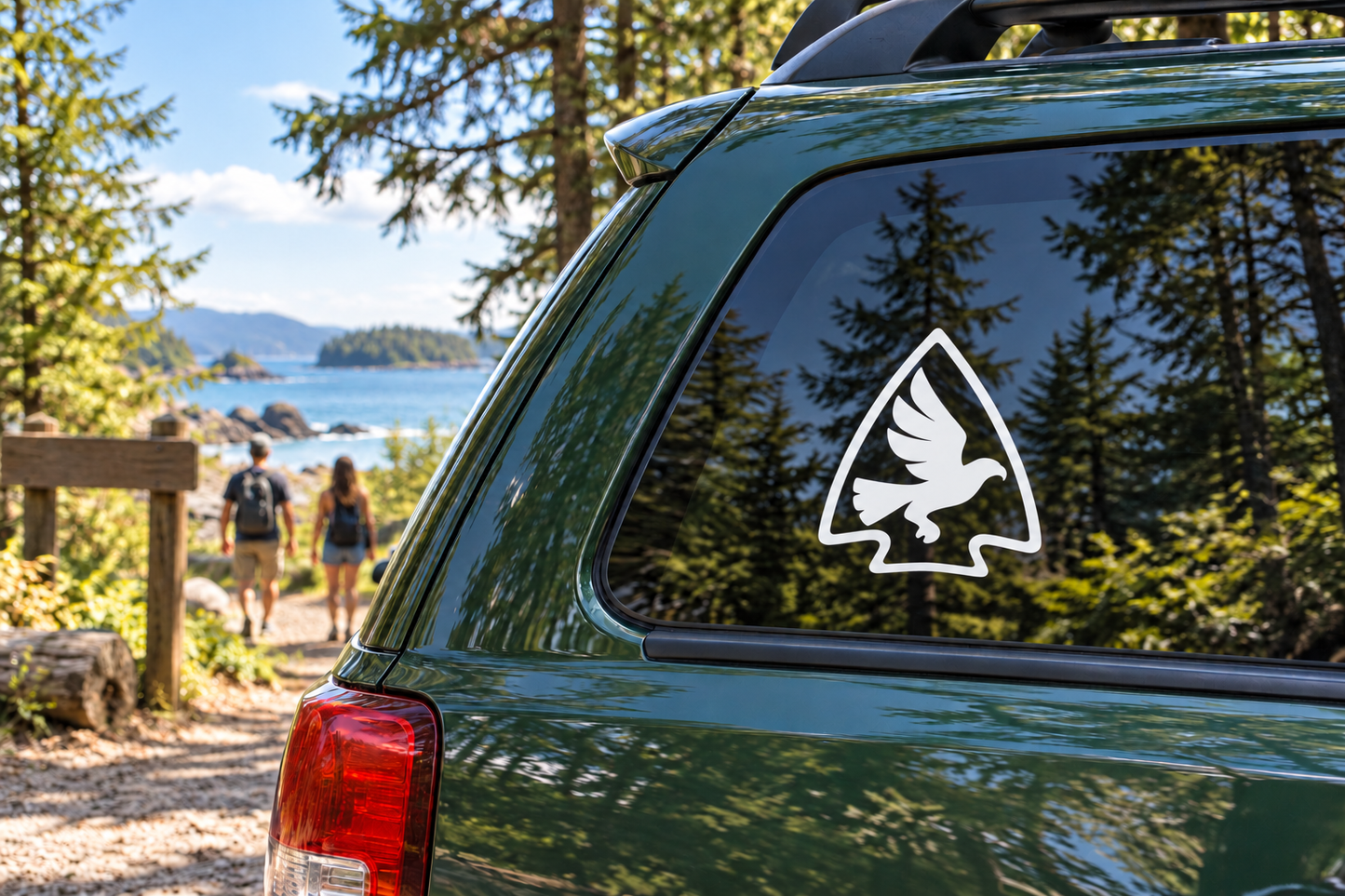 Hawk flight vinyl decal on a car rear window, white triangle with black hawk