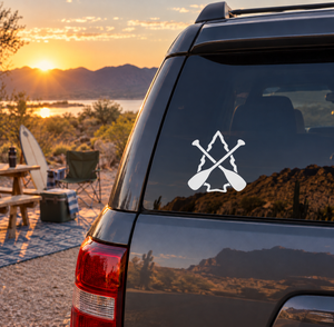White twin paddles arrowhead vinyl decal on dark car rear window