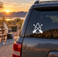 White twin paddles arrowhead vinyl decal on dark car rear window