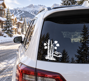 White aspen grove vinyl decal on car rear window, mountain silhouette and trees