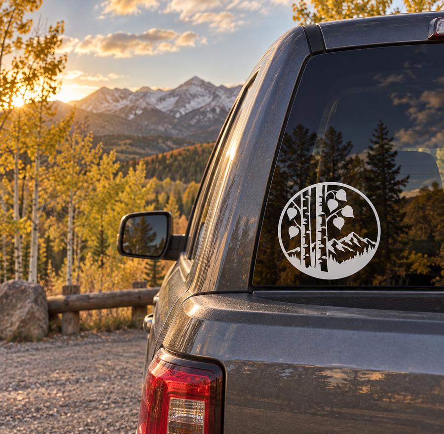 Circular vinyl decal with bear silhouette, trees, and mountain scene for truck windows.