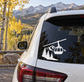 Black vinyl decal of gondola over pine trees and mountain peaks for car windows