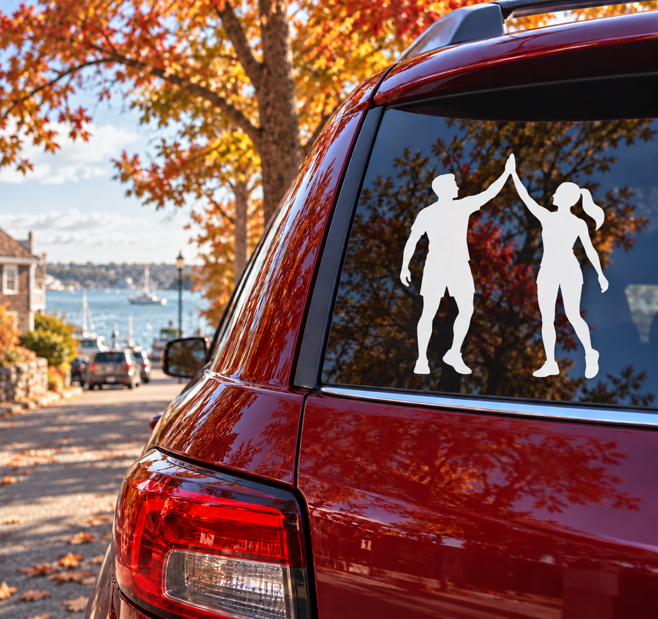 Athletics track day partners vinyl decal with three black sports silhouettes on car window