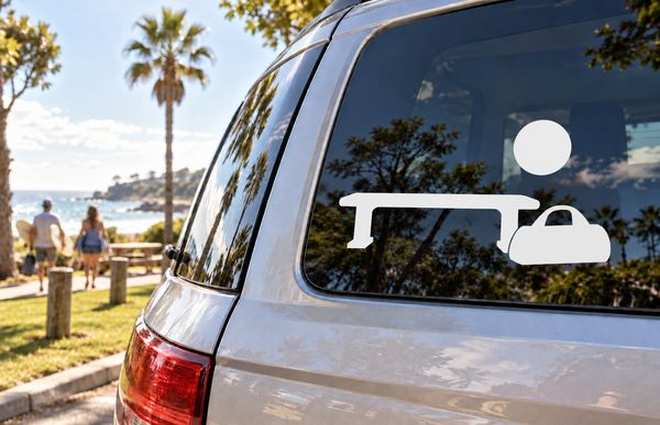 Vinyl decal on car window: sun circle above bench icon and wheel-like shapes