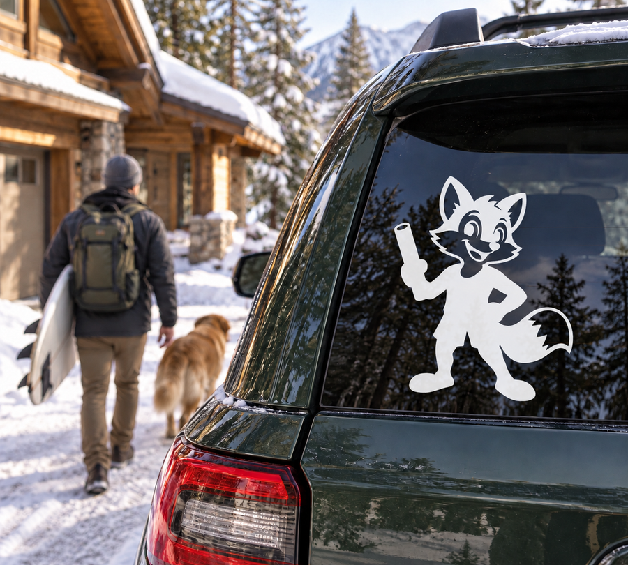 Spirit vinyl decal: white fox mascot holding bone on car window