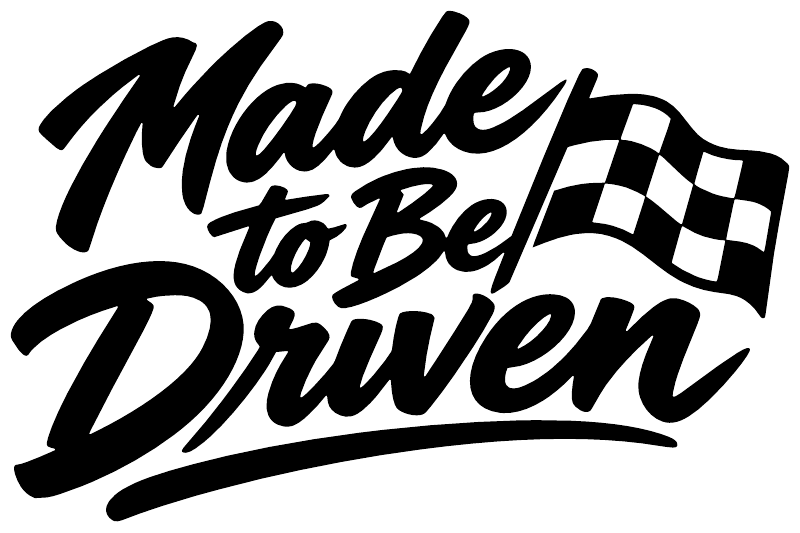 Black “Made to Be Driven” decal lettering with checkered flag