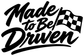 Black “Made to Be Driven” decal lettering with checkered flag