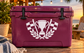 Maroon vinyl decal with trophy, racing checkered flags, and laurel wreath