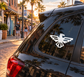 White stepped-wing eagle vinyl decal on car rear window