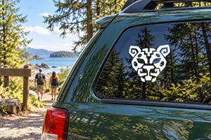 Jaguar crest vinyl decal with black-and-white jaguar head on car window