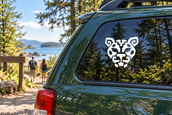 Jaguar crest vinyl decal with black-and-white jaguar head on car window
