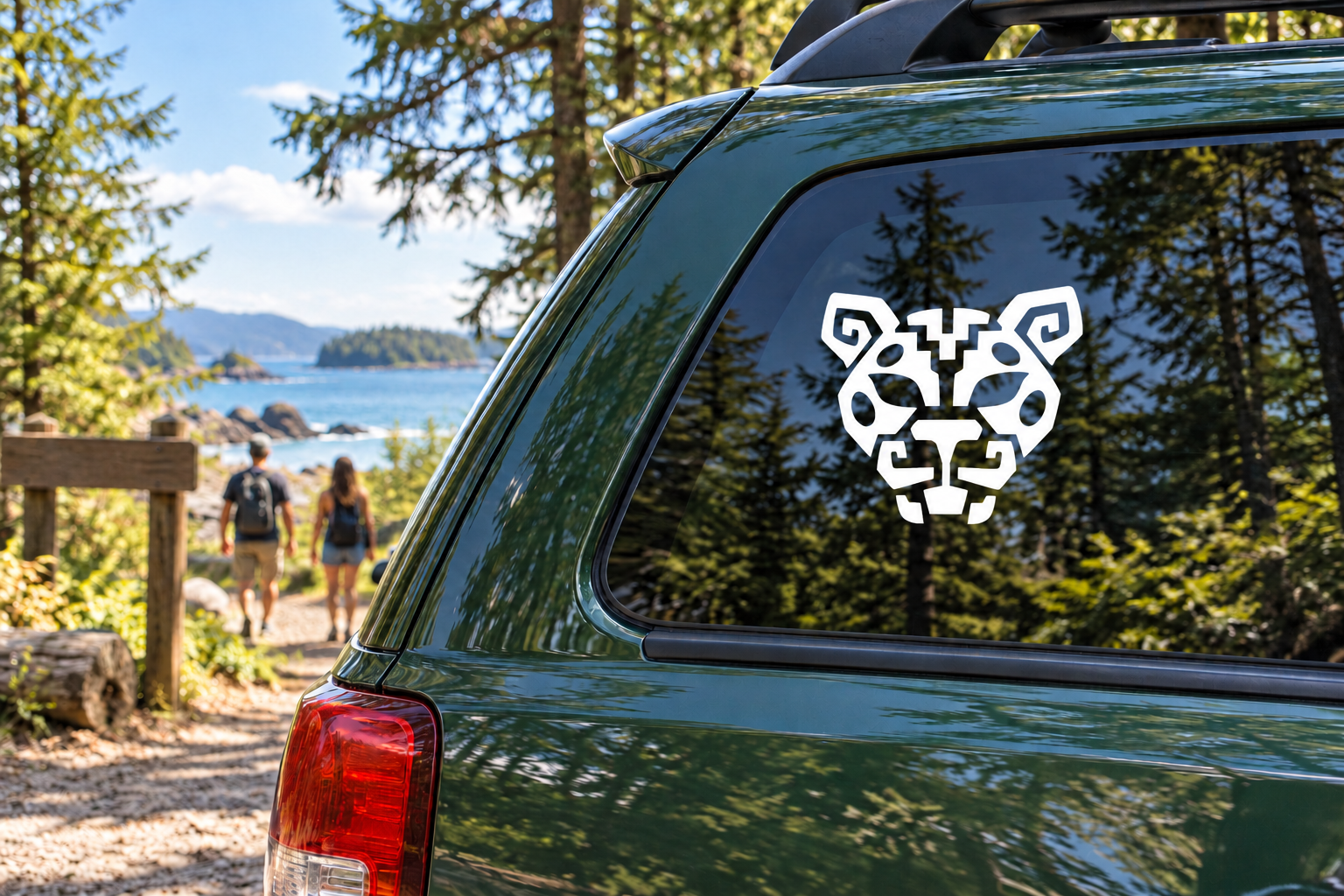 Jaguar crest vinyl decal with black-and-white jaguar head on car window