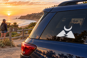 Moon and mountain lightning vinyl decal on car rear window, black and white