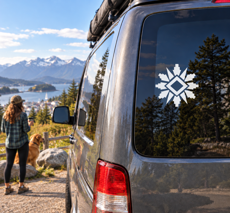 Solar wheel vinyl decal showing black-and-white starburst with diamond center on car window