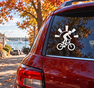 BMX vinyl decal of a silhouetted rider on a bicycle with sunburst rays