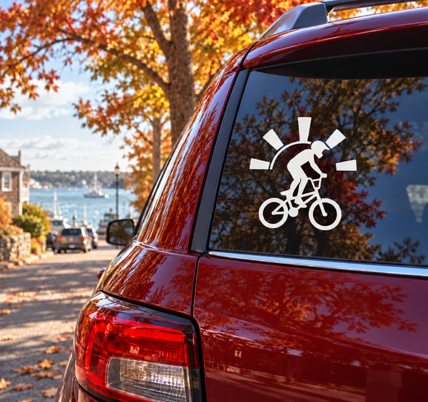 BMX vinyl decal of a silhouetted rider on a bicycle with sunburst rays