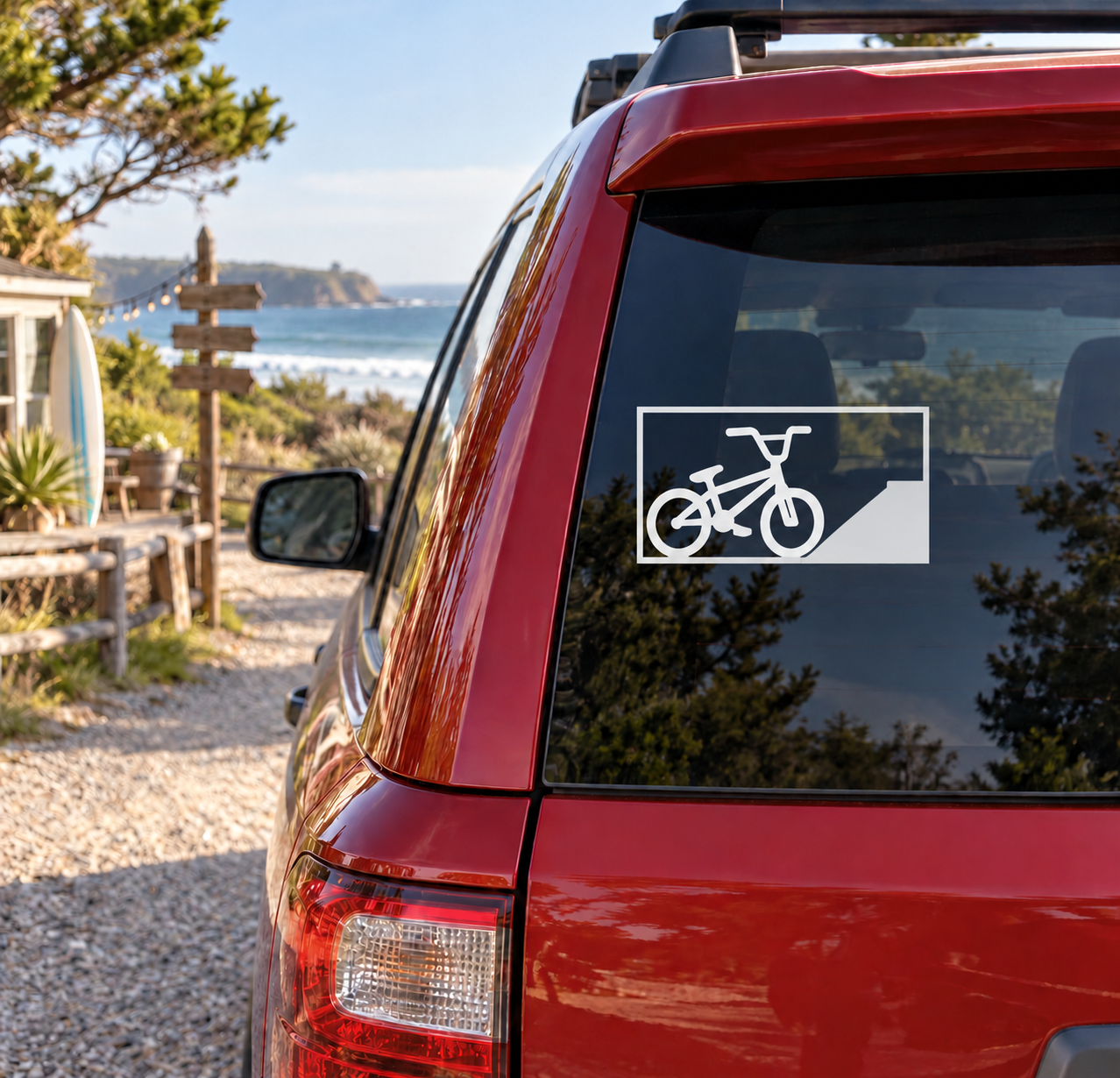 BMX brick bank vinyl decal on car window, black and white bicycle graphic