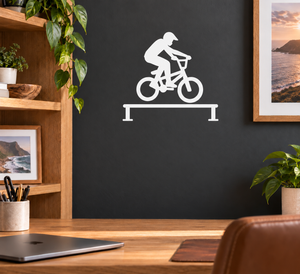 BMX rail vinyl decal: white rider silhouette on BMX bike over a horizontal rail