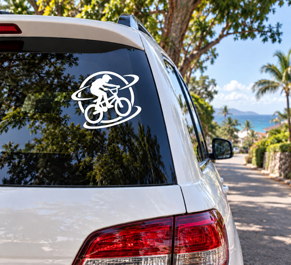 BMX wheel orbit vinyl decal with rider silhouette, white graphic on dark window