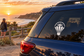 Hot air balloon vinyl decal on car rear window, black and white crest with sunburst
