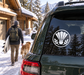 Round vinyl decal with badminton shuttle and laurel wreath emblem on a car rear window