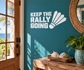 White vinyl wall decal with “KEEP THE RALLY GOING” text and shuttlecock graphic