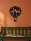 Black hot air balloon vinyl decal with orange detail lines and basket