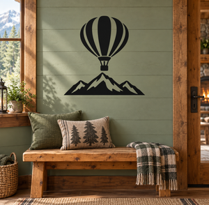Hot air balloon and mountain vinyl wall decal, black design on a pale green wall
