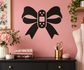 Black bow vinyl decal with bandage-style center and dotted detail