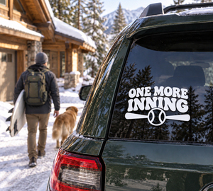 Baseball-themed vinyl decal: 'ONE MORE INNING' with baseball icon on car window.