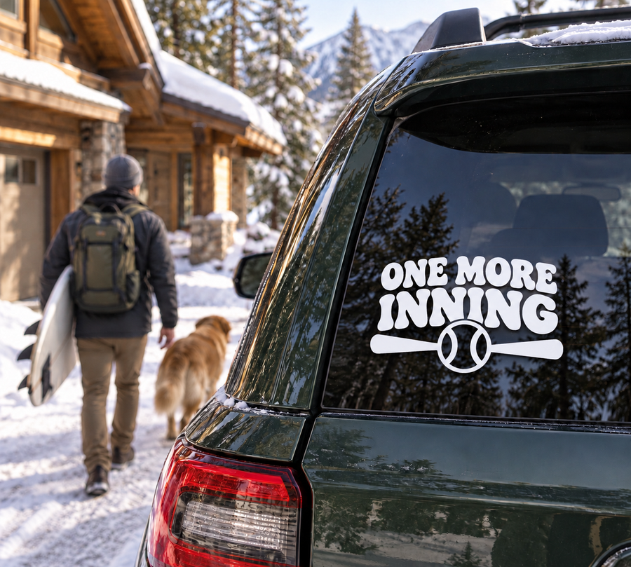 Baseball-themed vinyl decal: 'ONE MORE INNING' with baseball icon on car window.
