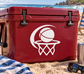 White basketball hoop and moon vinyl decal on a red surface