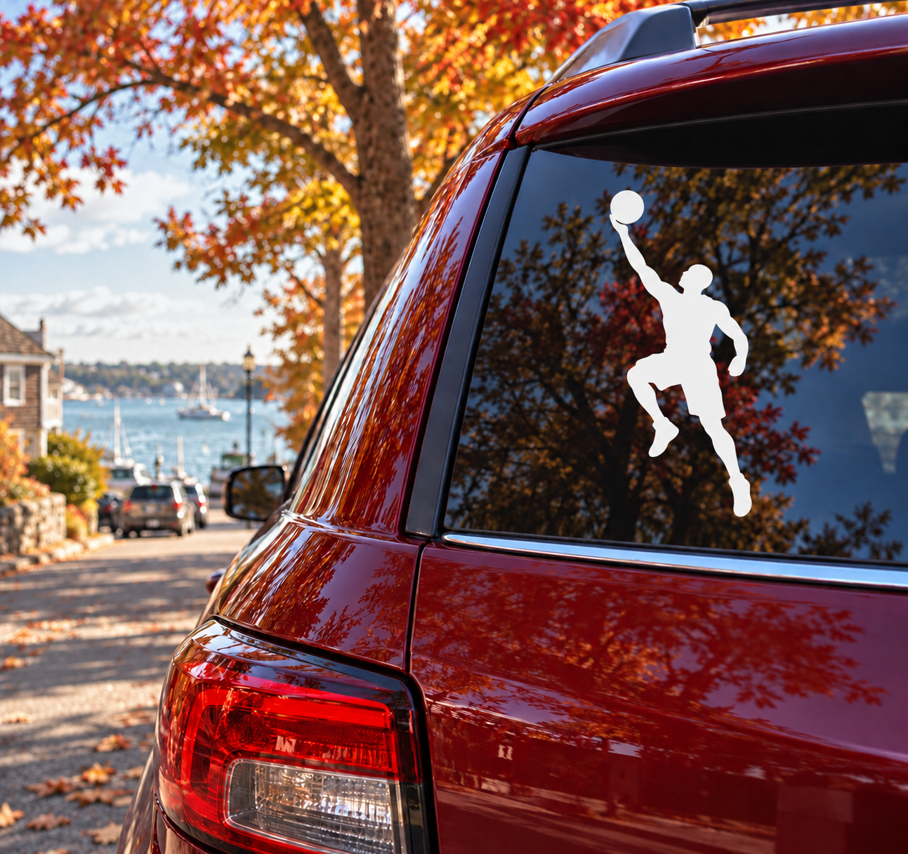 Basketball layup arc vinyl decal of a dribbling player silhouette on car window