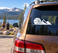 Vinyl basketball and mountain decal on car rear window, white design
