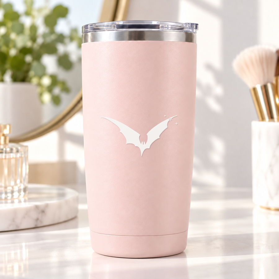 Pink tumbler with white bat silhouette and small constellation sparkle cluster decal