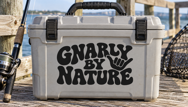 Vinyl decal reading 'Gnarly by Nature' with fist graphic, black lettering on light background.