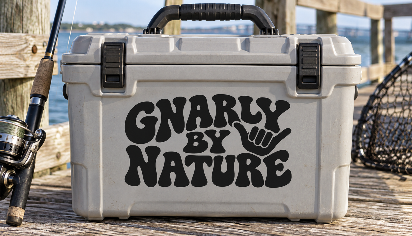 Vinyl decal reading 'Gnarly by Nature' with fist graphic, black lettering on light background.